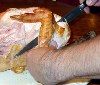 Cut through the joint to remove the wing