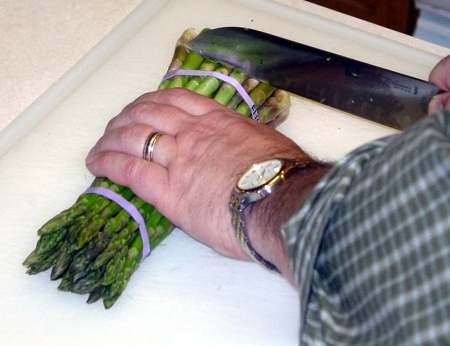 Trim the woody part from the bottom of the asparagus spears. Trim the woody part from the bottom of the asparagus spears.